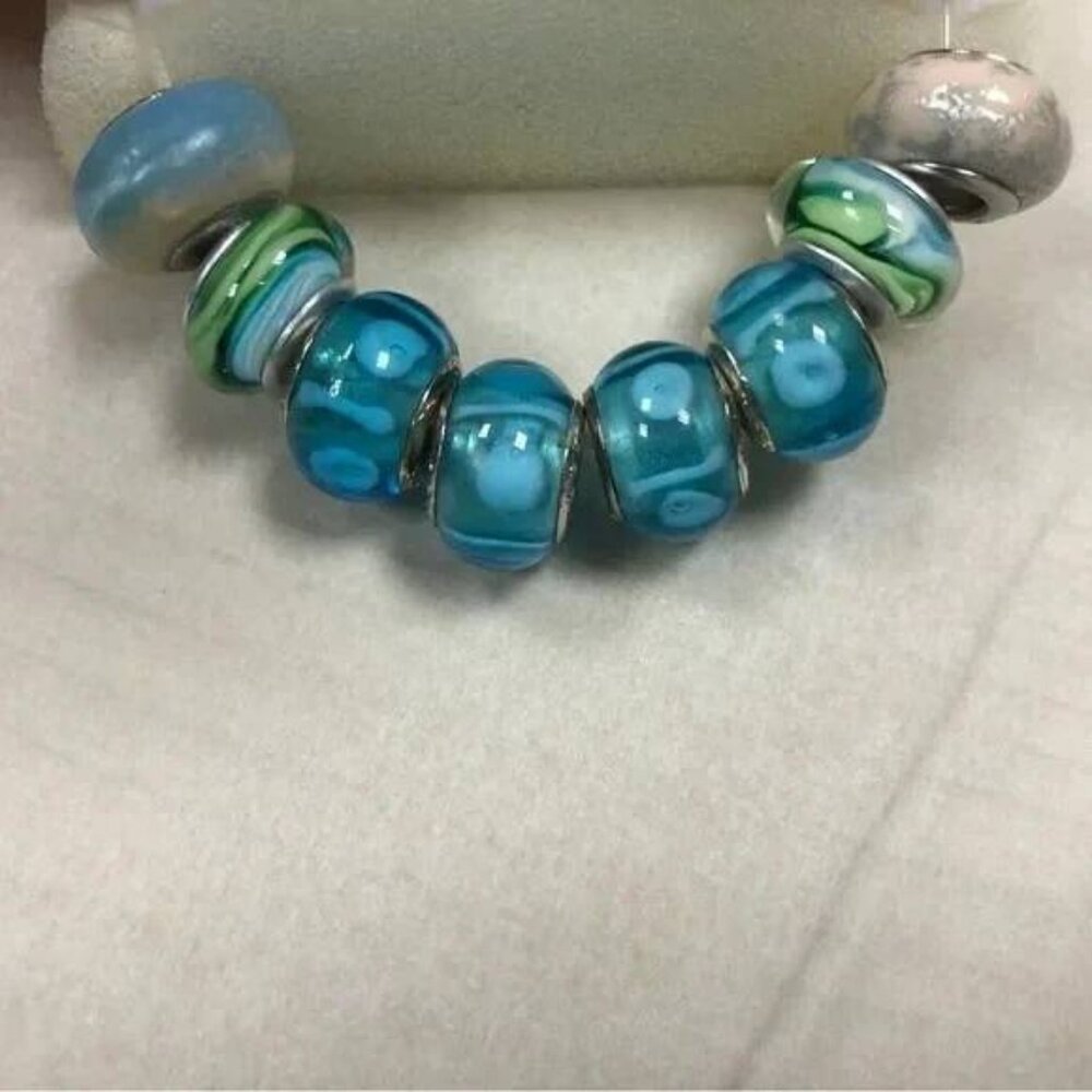 8 Miscellaneous Beads Including Pugster